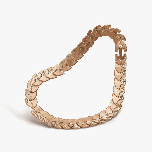 Luxury Cuore di Moringa necklace handcrafted in 18K rose FairTrade ethical gold, featuring intricate burned and engraved details—designed by Riccardo Contini