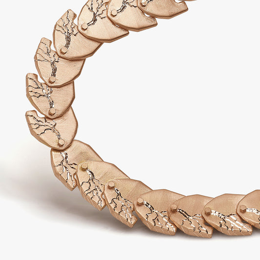 Luxury Cuore di Moringa necklace handcrafted in 18K rose FairTrade ethical gold, featuring intricate burned and engraved details—designed by Riccardo Contini