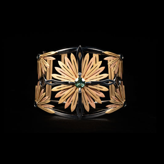 Luxury Echinacea Fascia bracelet handcrafted in 18K ethical gold, featuring a central sapphire—an emblem of resilience and natural healing, inspired by the Echinacea flower and designed by Riccardo Contini