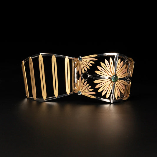 Luxury Echinacea Fascia bracelet handcrafted in 18K ethical gold, featuring a central sapphire—an emblem of resilience and natural healing, inspired by the Echinacea flower and designed by Riccardo Contini
