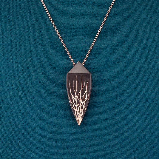 Luxury Eclissi Andromeda pendant handcrafted in 18K rose ethical gold with burned engravings, inspired by celestial phenomena and cosmic elegance – designed by Riccardo Contini