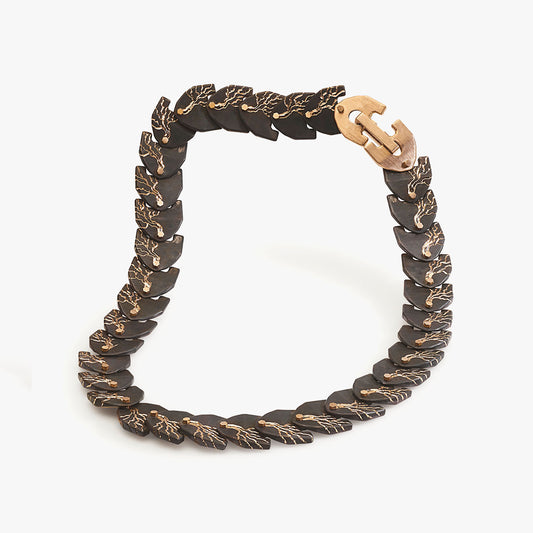 Luxury Eclissi Cuore di Moringa necklace handcrafted in 18K rose ethical gold with burned, engraved details—limited edition of 7 pieces, designed by Riccardo Contini