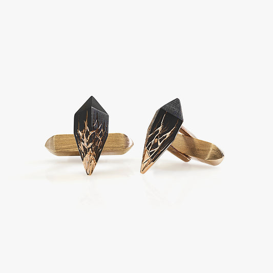 Luxury Eclissi Infranti Distanti cufflinks handcrafted in 18K rose ethical gold with burned engravings, inspired by natural tension and tribal aesthetics – designed by Riccardo Contini
