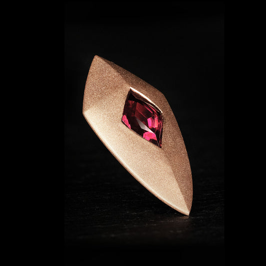 Luxury Freccia Scarlatta pendant handcrafted in 18K satin-finished rose ethical gold, featuring a striking red garnet—an arrow of passion, energy, and direction by Riccardo Contini