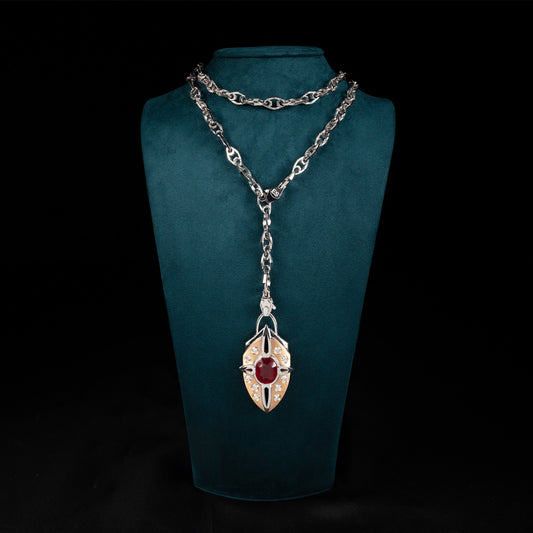 Luxury Nuvola Rossa pendant necklace handcrafted in 18K ethical gold with a vivid ruby, evoking the fiery soul of a red cloud in motion – designed by Riccardo Contini