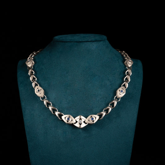 Luxury Soffio di Tate necklace handcrafted in 18K natural white ethical gold, adorned with sapphires and diamonds—an ethereal breath of memory and light by Riccardo Contini