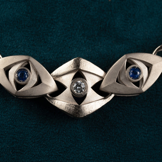 Luxury Soffio di Tate necklace handcrafted in 18K natural white ethical gold, adorned with sapphires and diamonds—an ethereal breath of memory and light by Riccardo Contini