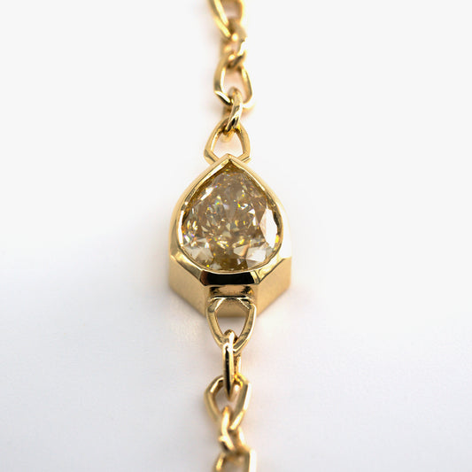 Luxury Sospiro di Luce bracelet handcrafted in 18K yellow ethical gold, featuring a brownish yellow diamond—an intimate breath of light and elegance by Riccardo Contini