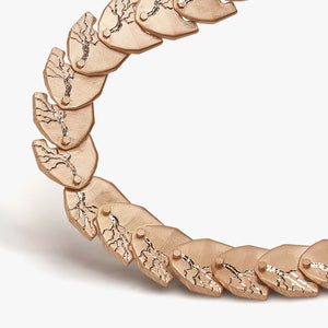 Luxury Cuore di Moringa necklace handcrafted in 18K rose FairTrade ethical gold, featuring intricate burned and engraved details—designed by Riccardo Contini