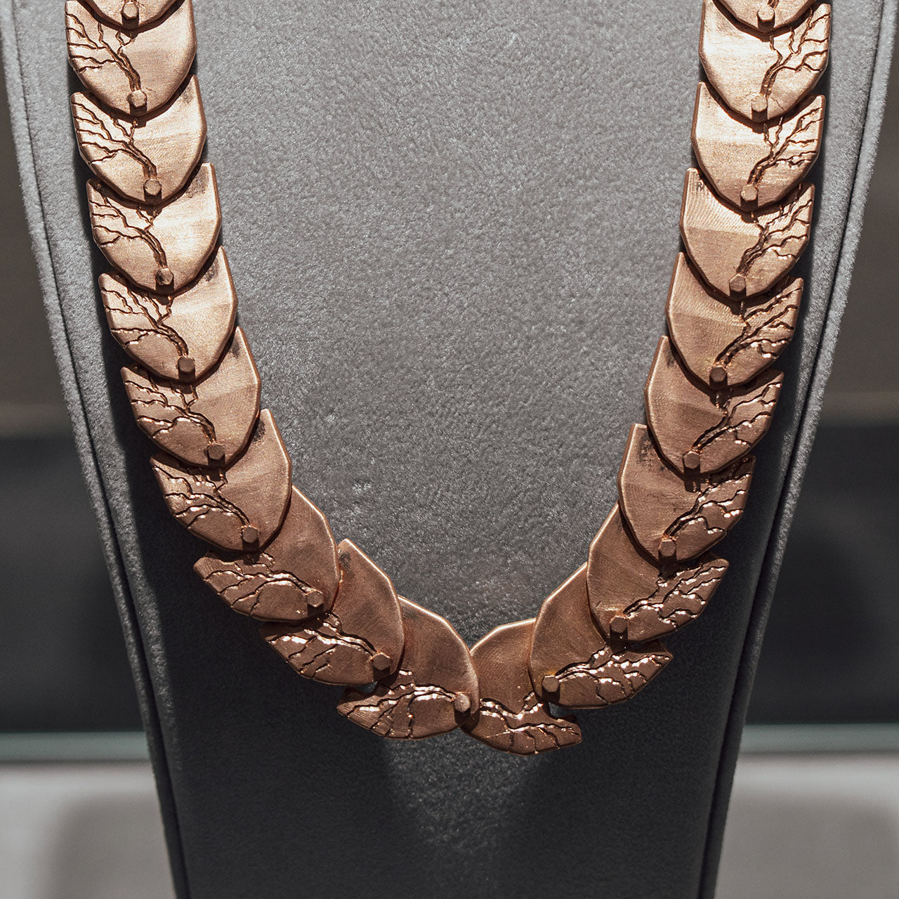Luxury Cuore di Moringa necklace handcrafted in 18K rose FairTrade ethical gold, featuring intricate burned and engraved details—designed by Riccardo Contini