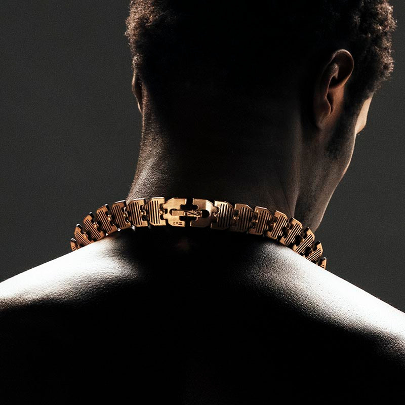 Luxury Cuore di Moringa necklace handcrafted in 18K rose FairTrade ethical gold, featuring intricate burned and engraved details—designed by Riccardo Contini