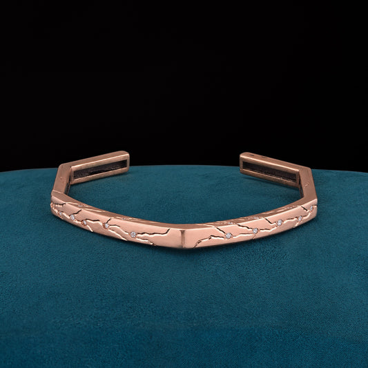 Luxury Dedizione di Luce bracelet handcrafted in 18K rose ethical gold with diamonds, symbolizing unwavering devotion through refined engraving and timeless craftsmanship – designed by Riccardo Contini

