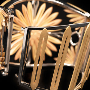 Luxury Echinacea Fascia bracelet handcrafted in 18K ethical gold, featuring a central sapphire—an emblem of resilience and natural healing, inspired by the Echinacea flower and designed by Riccardo Contini