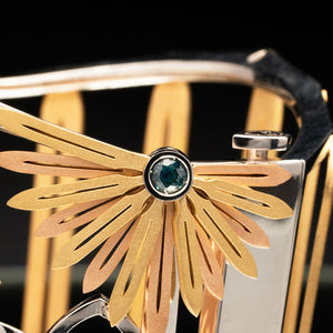 Luxury Echinacea Fascia bracelet handcrafted in 18K ethical gold, featuring a central sapphire—an emblem of resilience and natural healing, inspired by the Echinacea flower and designed by Riccardo Contini