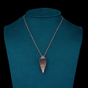Luxury Eclissi Andromeda pendant handcrafted in 18K rose ethical gold with burned engravings, inspired by celestial phenomena and cosmic elegance – designed by Riccardo Contini