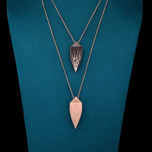 Luxury Eclissi Andromeda pendant handcrafted in 18K rose ethical gold with burned engravings, inspired by celestial phenomena and cosmic elegance – designed by Riccardo Contini