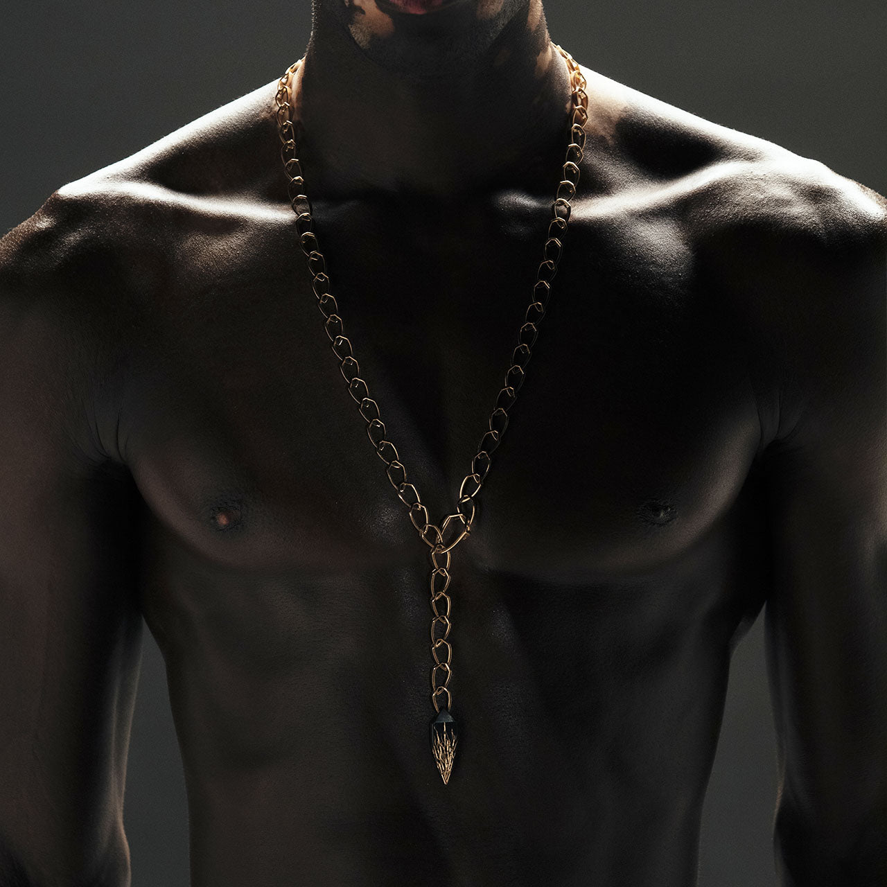 Luxury Eclissi Catena Andromeda necklace handcrafted in 18K ethical gold with burned engravings, blending cosmic symbolism and artisanal detail – designed by Riccardo Contini