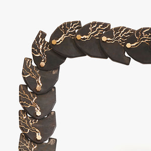 Luxury Eclissi Cuore di Moringa necklace handcrafted in 18K rose ethical gold with burned, engraved details—limited edition of 7 pieces, designed by Riccardo Contini