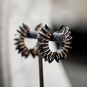Luxury Eclissi Sole Tribale earrings handcrafted in 18K rose ethical gold with burned, engraved details—radiating tribal elegance and solar inspiration, designed by Riccardo Contini