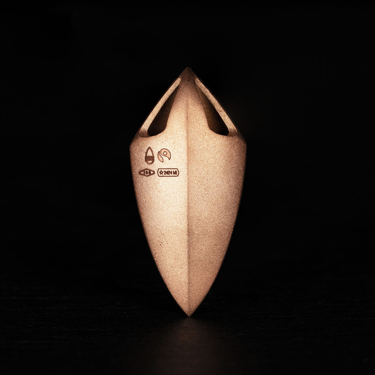 Luxury Freccia Scarlatta pendant handcrafted in 18K satin-finished rose ethical gold, featuring a striking red garnet—an arrow of passion, energy, and direction by Riccardo Contini