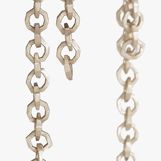 Luxury Legami di Luce earrings handcrafted in 18K rose ethical gold with a satin-burnished finish, evoking the poetic beauty of invisible bonds and light – designed by Riccardo Contini