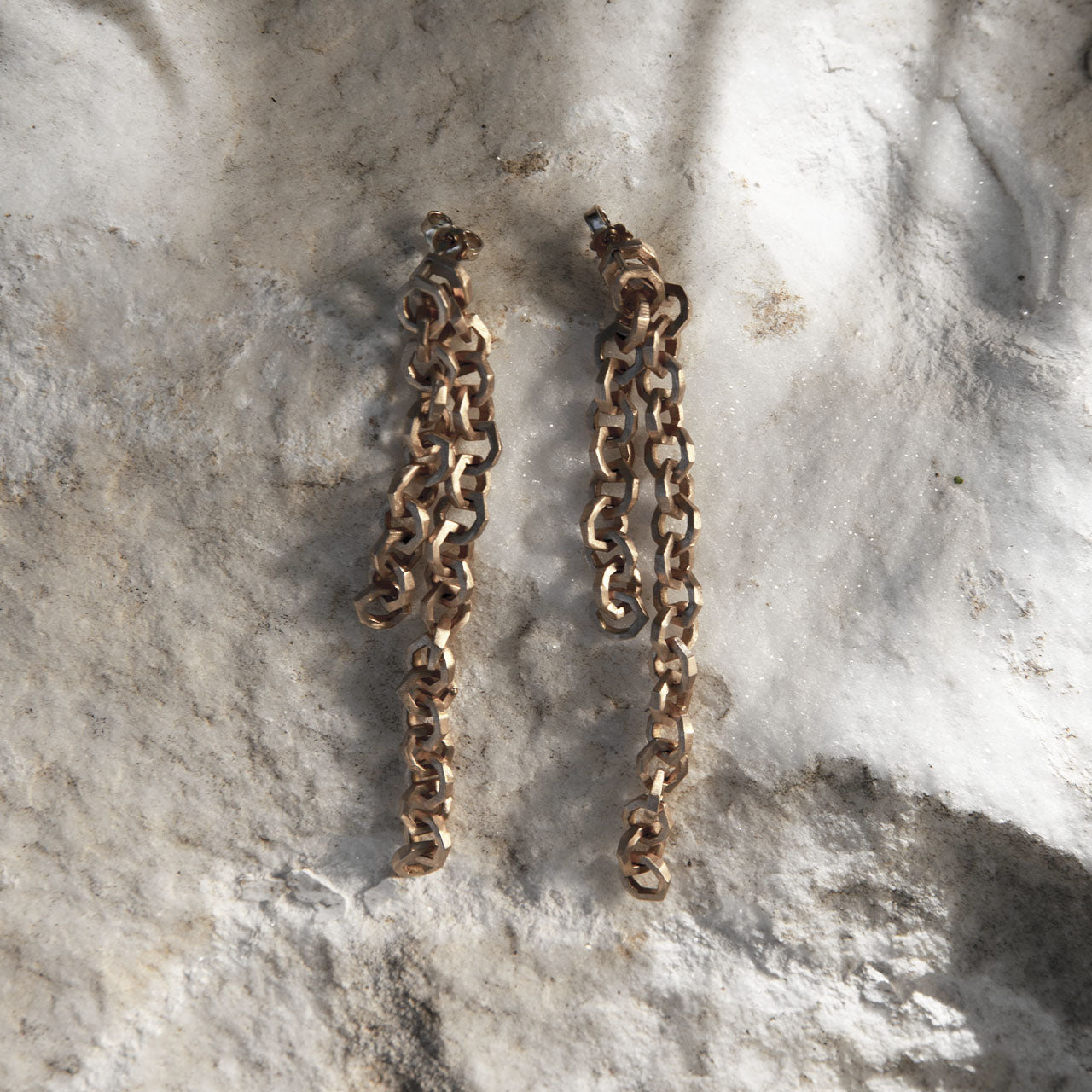 Luxury Legami di Luce earrings handcrafted in 18K rose ethical gold with a satin-burnished finish, evoking the poetic beauty of invisible bonds and light – designed by Riccardo Contini