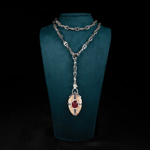 Luxury Nuvola Rossa pendant necklace handcrafted in 18K ethical gold with a vivid ruby, evoking the fiery soul of a red cloud in motion – designed by Riccardo Contini