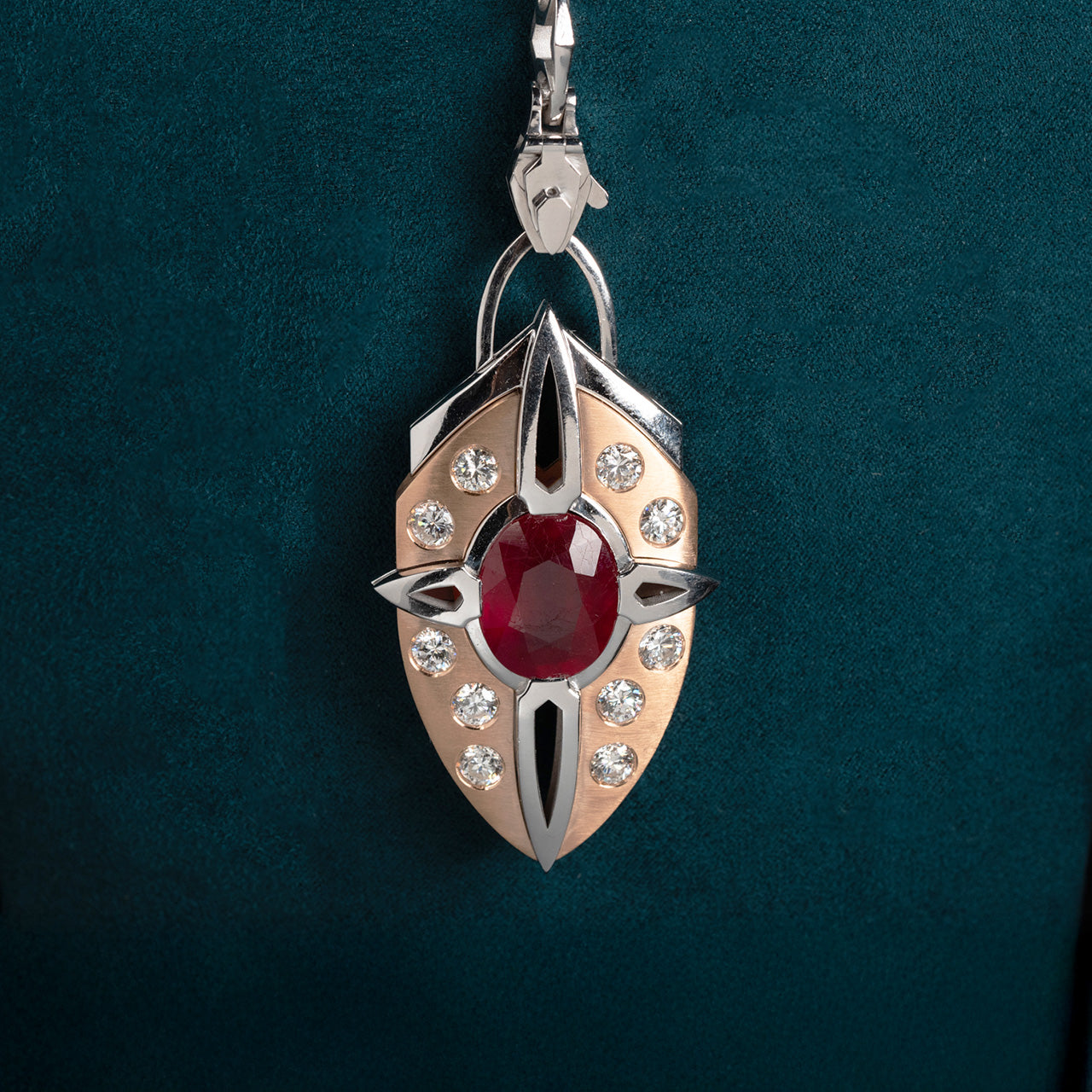 Luxury Nuvola Rossa pendant necklace handcrafted in 18K ethical gold with a vivid ruby, evoking the fiery soul of a red cloud in motion – designed by Riccardo Contini