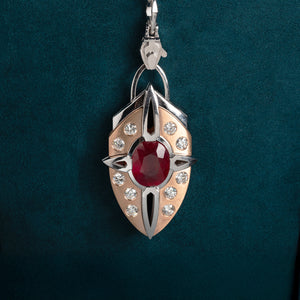 Luxury Nuvola Rossa pendant necklace handcrafted in 18K ethical gold with a vivid ruby, evoking the fiery soul of a red cloud in motion – designed by Riccardo Contini