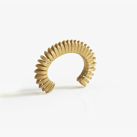 Luxury Sole Tribale bracelet handcrafted in 18K yellow ethical gold with subtle engravings, a radiant tribute to the sun’s strength and symbolism – designed by Riccardo Contini