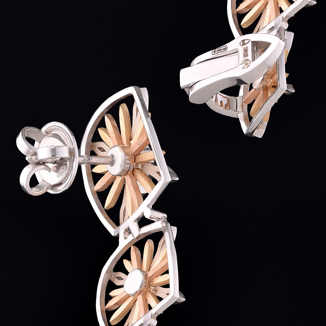 Inspired by the Echinacea flower, symbolizing strength and healing, the Sospiro di Echinacea earrings are limited-edition, handcrafted luxury pieces in 18K rose and white ethical gold adorned with sapphires, designed by Riccardo Contini.​