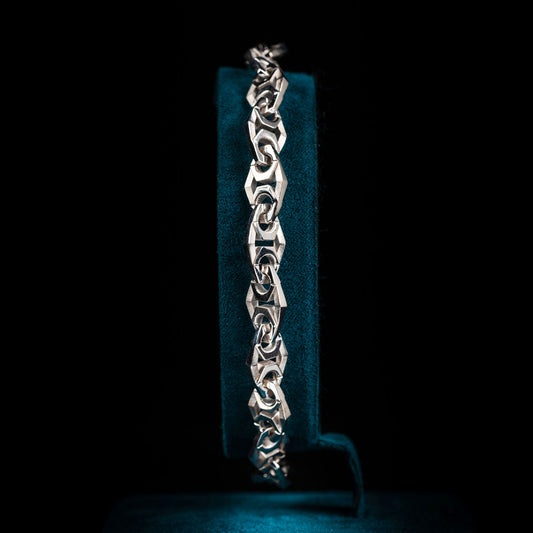 Luxury Xylem bracelet handcrafted in 18K white ethical gold with rhodium plating, inspired by nature's vital channels—symbolizing strength, growth, and the quiet beauty of staying rooted. Designed by Riccardo Contini.